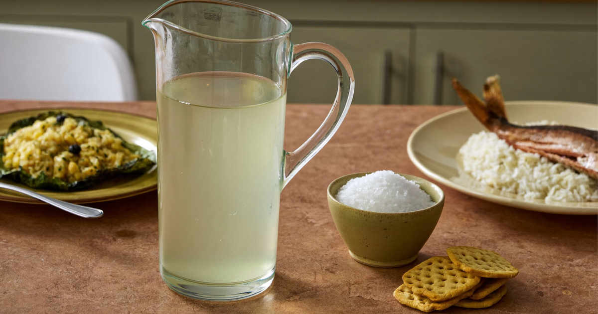 Short bowel syndrome in Crohn's disease - oral rehydration solution, salty foods and a meal plate arranged on a kitchen counter